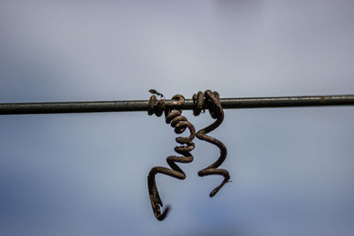 Close-up of chain against clear sky
