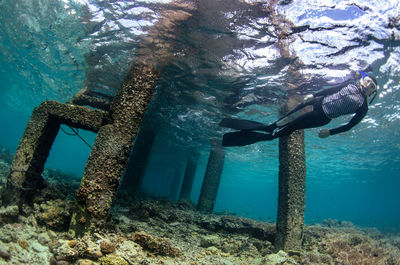 High angle view of man swimming in sea