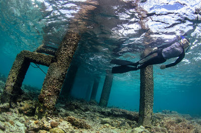 High angle view of woman swimming in sea