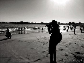Woman standing on beach