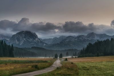 Scenic view of landscape and mountains against sky