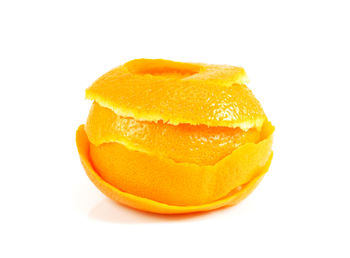 Close-up of orange slice against white background