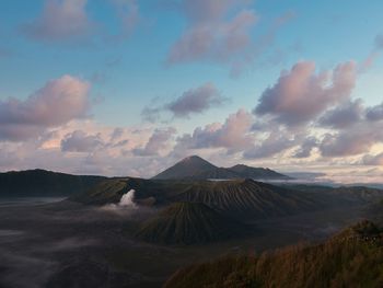 View of volcanic landscape against cloudy sky