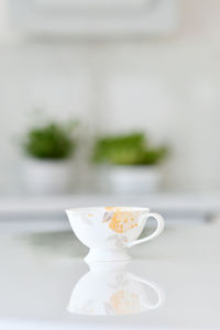 Close-up of coffee cup on table