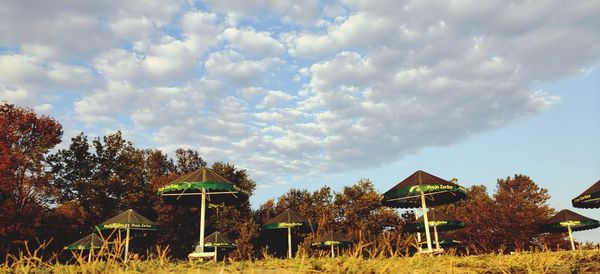 Houses and trees against sky