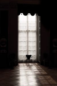 Empty chairs and table in building