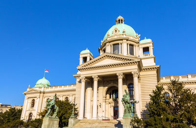 Low angle view of building against blue sky