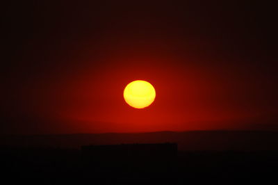 Scenic view of dramatic sky during sunset