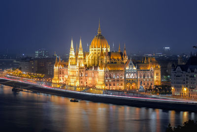 Illuminated buildings in city at night