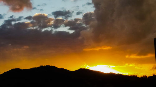 Scenic view of mountains at sunset