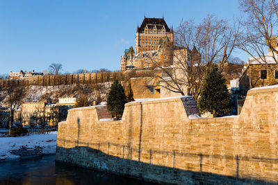 The upper old town skyline seen from the petit-champlain sector during an winter golden hour morning