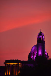 Silhouette building against sky during sunset