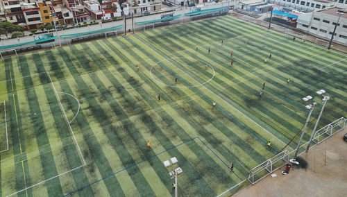 Aerial view of the football field in the middle of a messy neighborhood, callao, lima. peru