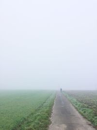 Scenic view of agricultural field against clear sky