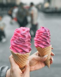 Cropped hand holding ice cream cone