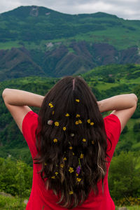 Rear view of woman with hat on mountain