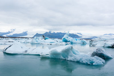 Scenic view of frozen sea against sky