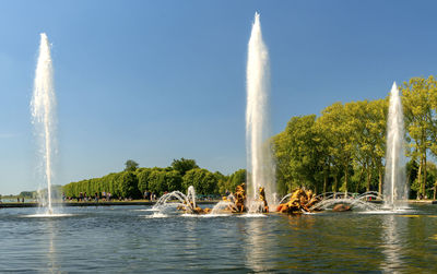 Fountains in the gardens of palace of versailles, paris, france