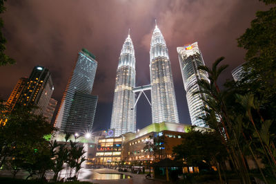 Low angle view of skyscrapers lit up at night