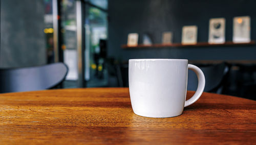 Close-up of coffee cup on table