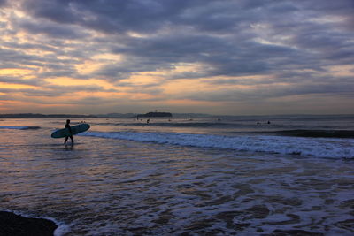 Scenic view of sea against cloudy sky