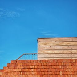 Low angle view of building against blue sky