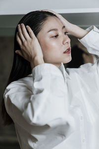 Portrait of young woman with eyes closed