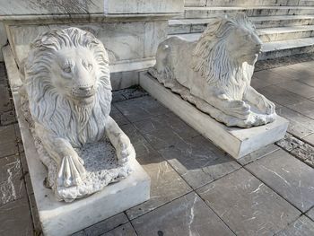 Statue of cat on tiled floor