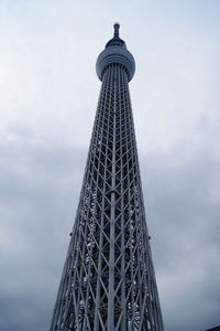 Low angle view of communications tower against sky