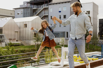 Father walking with daughter