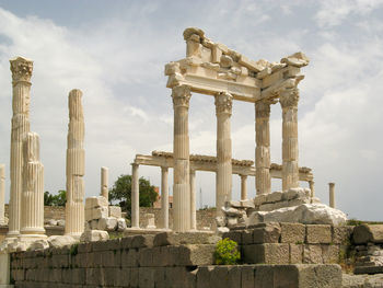 Old ruins of temple against cloudy sky