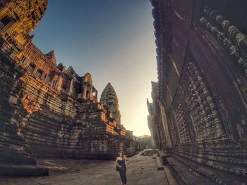 Tourist among historic buildings