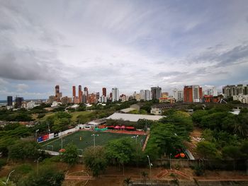 High angle view of trees and buildings against sky