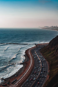 High angle view of road by sea against sky