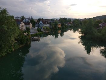 Panoramic view of lake and buildings against sky