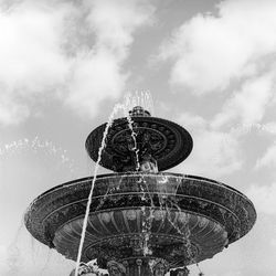 Low angle view of ferris wheel against sky