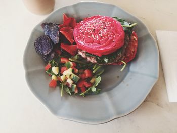 High angle view of chopped fruits in plate on table