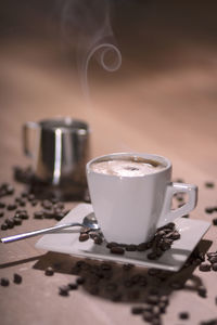 Close-up of coffee cup on table