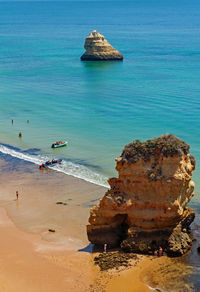 High angle view of rock formations on beach