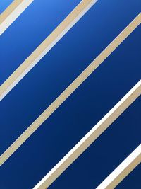 Full frame shot of metallic structure against blue sky