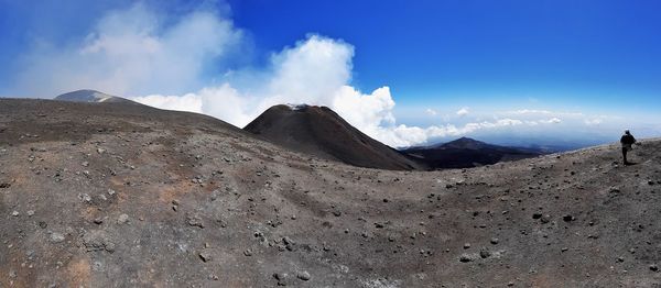 Panoramic view of arid landscape against sky