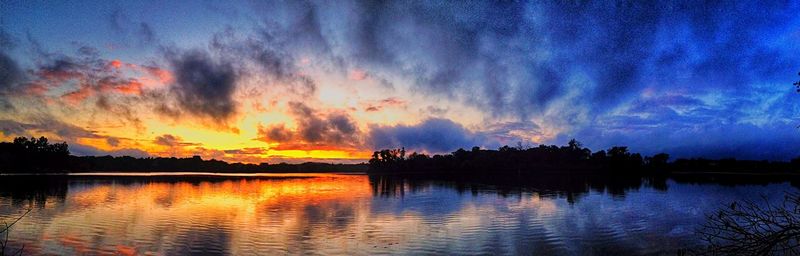 Scenic view of lake at sunset