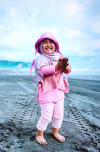 The happy smile of the baby on the beach