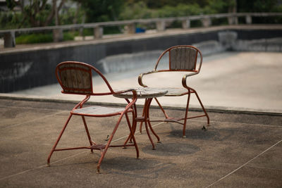 Empty chairs and table on floor