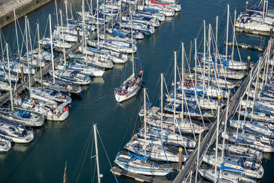 High angle view of boats moored at harbor