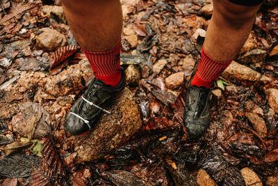 Low section of person wearing shoes outdoors