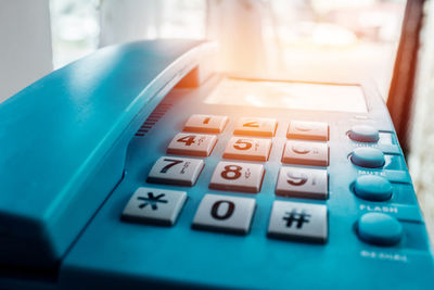 Close-up of turquoise telephone