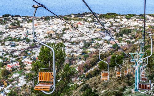 Ski lifts over cityscape