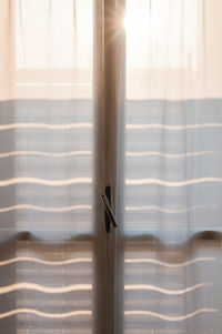 Close-up of curtain on window