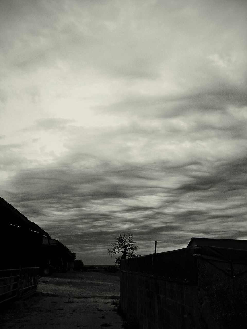 sky, built structure, cloud - sky, architecture, building exterior, cloudy, house, cloud, weather, overcast, tranquility, nature, tranquil scene, outdoors, roof, scenics, beauty in nature, landscape, no people, day